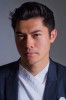 photo Henry Golding (voce)